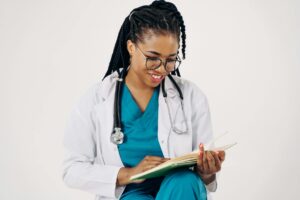 smiling doctor reading documents